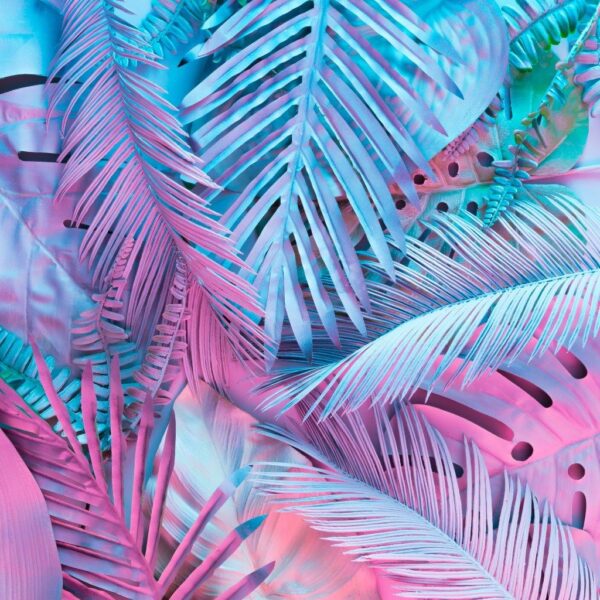 Tropical and palm leaves in vibrant bold gradient holographic neon colors